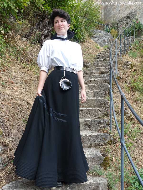 Vintage black and white photograph of a woman in a victorian-era black  ruffle dress on Craiyon